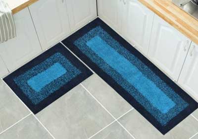 Chef walking on anti-slip rubber mat in a busy UK commercial kitchen